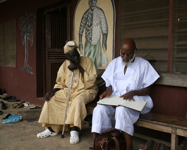 a picture of The greatest custodian of Ifa, the Araba of Ile Ife, Araba Adisa Mokorowale with Moyo Okediji July 26, 2017.