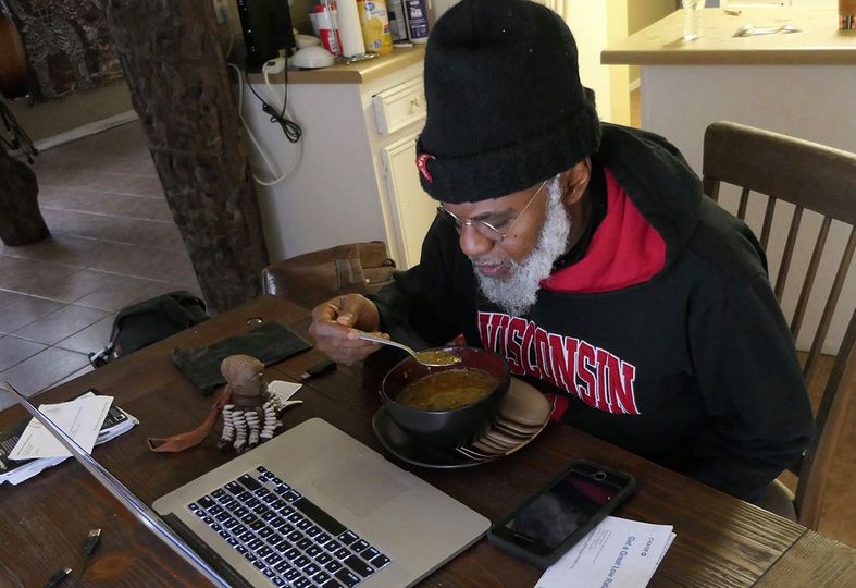 a picture of moyo okediji enjoying a plate of iru pepper soup