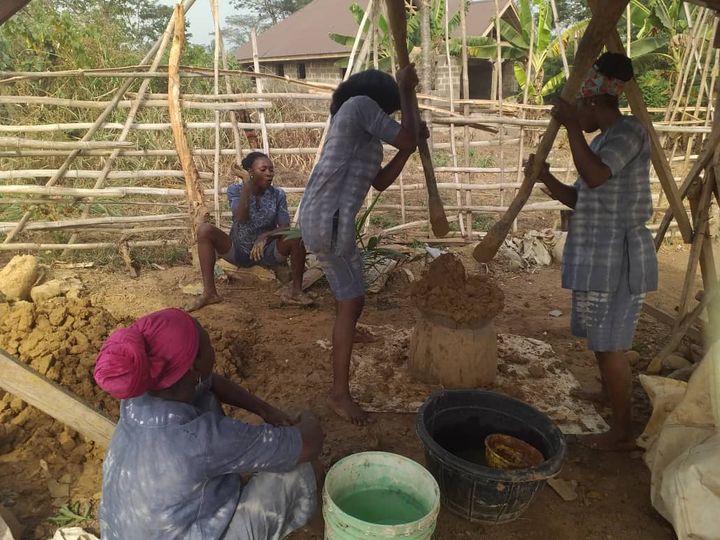 the akodi orisa artists pounding clay