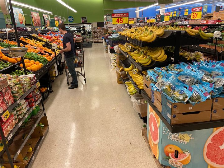 a picture showing moyo okediji at a supermarket