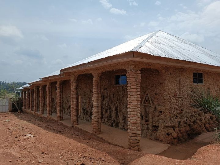 a picture showing the Akodi Orisa Sanctuary, Ile Ife, that Moyo okediji just completed the Rainbow (Osumare) Gallery. The Rainbow is the mixture of fire and water blazing with luminous intensity across the middle belt of the sky, affirming the unity of all colors, all peoples, all races, all tongues, all hands and heads, committed to the principle of creativity.