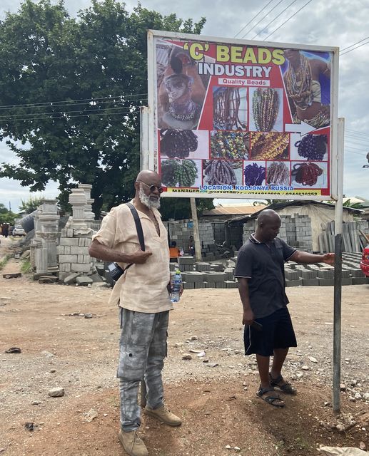 A picture showing Moyo Okediji standing by the roadside