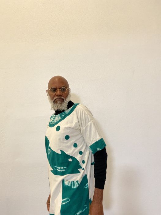 a picture showing moyo okediji wearing his appliqué shirt he found in his closet